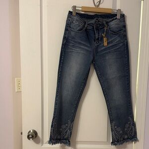 Elegant Blue Cropped Jeans with Embroidered Hem